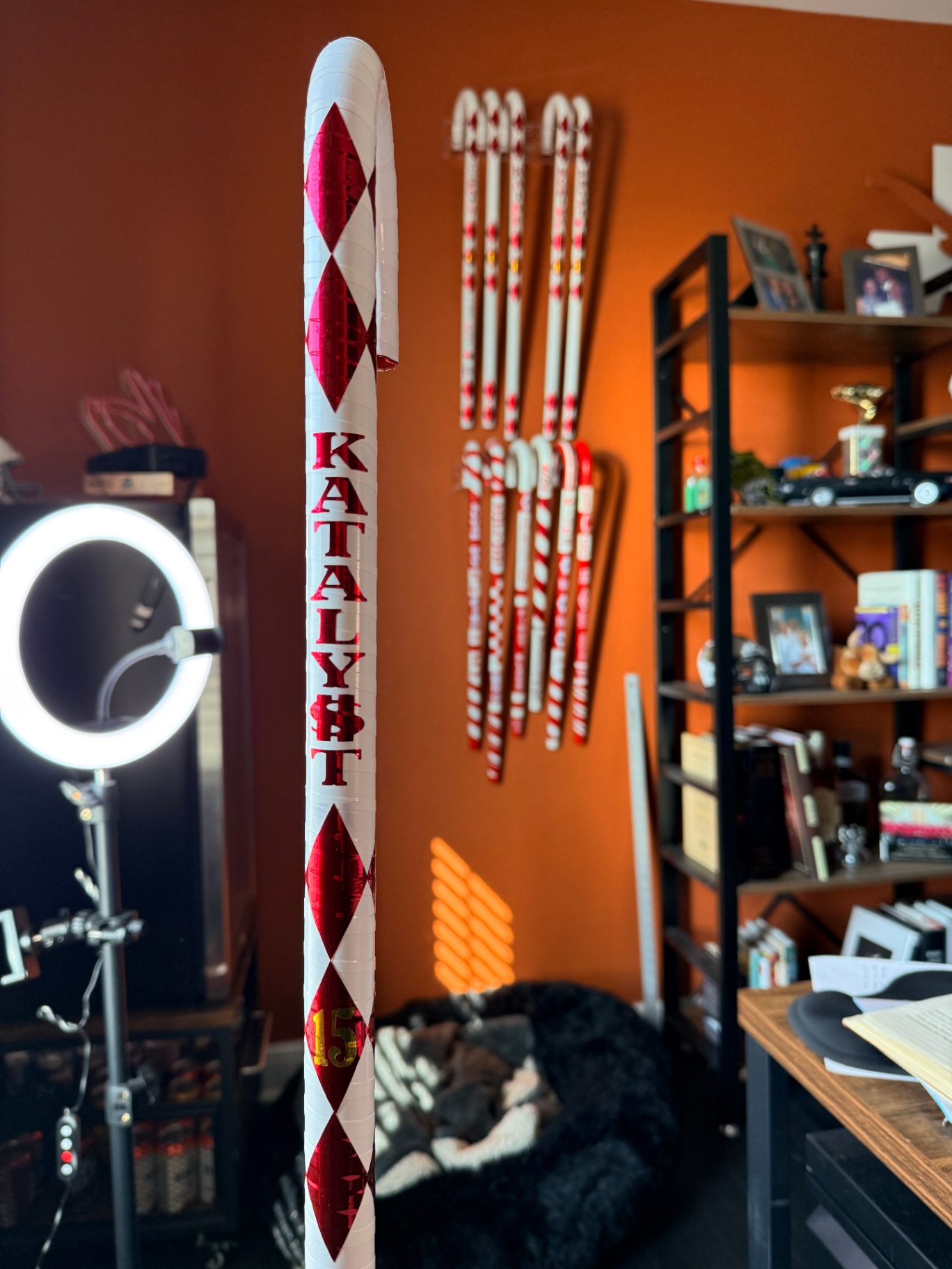 Katalyst cane with red diamond pattern and studio display